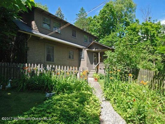 1122 Springfield Avenue New Providence, NJ 07974 - Photo 2 of 28 a front view of a house with garden