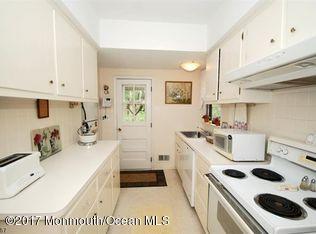 1122 Springfield Avenue New Providence, NJ 07974 - Photo 22 of 28 a kitchen with a sink a stove and white cabinets