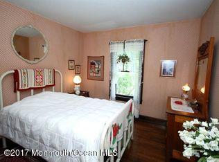 1122 Springfield Avenue New Providence, NJ 07974 - Photo 23 of 28 a bed room with a bed mirror and a chair