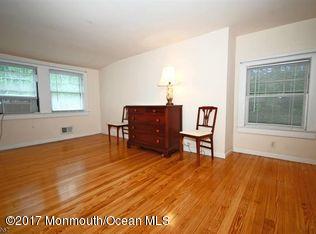 1122 Springfield Avenue New Providence, NJ 07974 - Photo 26 of 28 a view of a livingroom with furniture and wooden floor