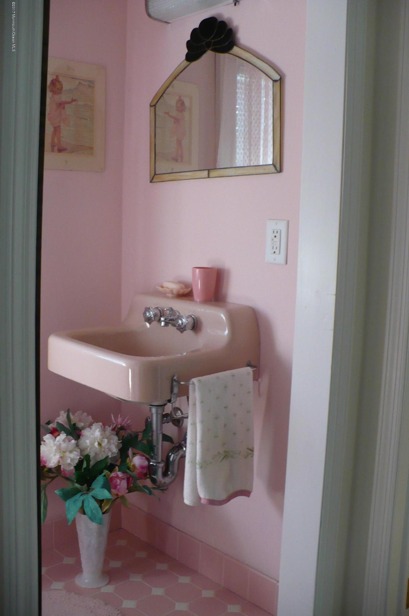 1122 Springfield Avenue New Providence, NJ 07974 - Photo 27 of 28 a bathroom with a sink and a mirror