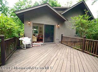 1122 Springfield Avenue New Providence, NJ 07974 - Photo 7 of 28 a view of a wooden deck with a bench