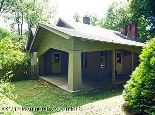 1122 Springfield Avenue New Providence, NJ 07974 - Photo 9 of 28 a front view of a house with a yard