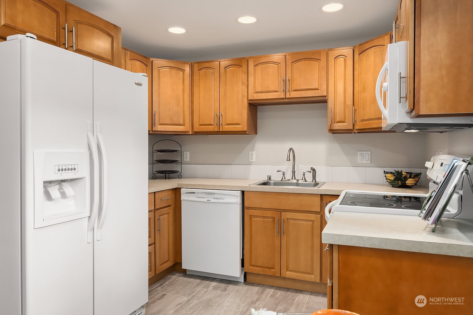 3625 Northeast 7th Place Renton, WA 98056 - Photo 13 of 23 a kitchen with a sink a refrigerator and cabinets