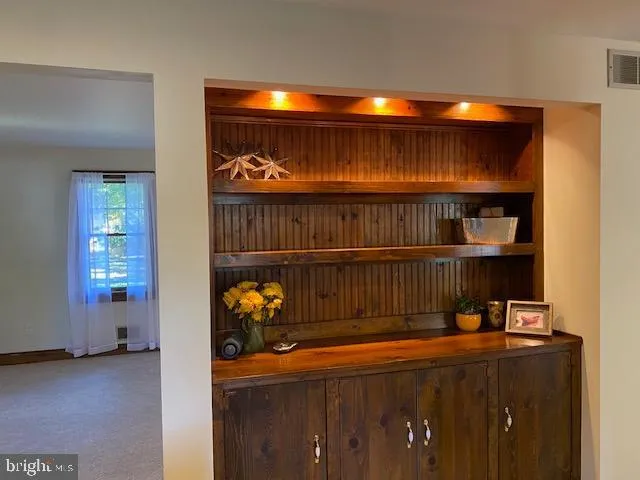 a kitchen with granite countertop wooden cabinets and stainless steel appliances