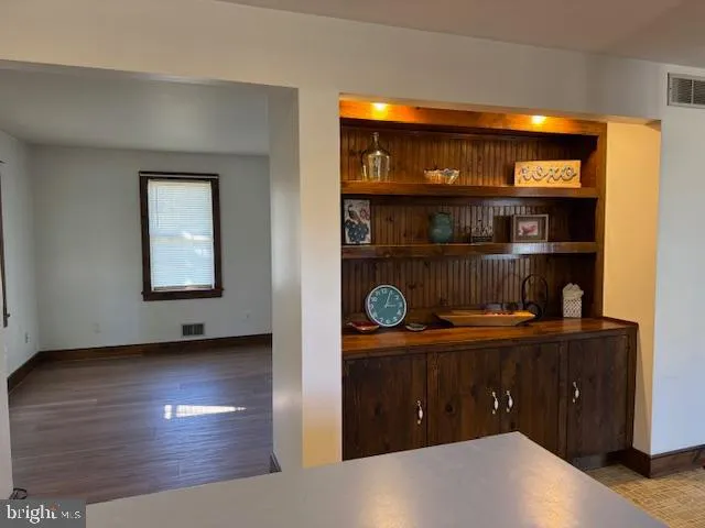 a view of workspace with wooden floor