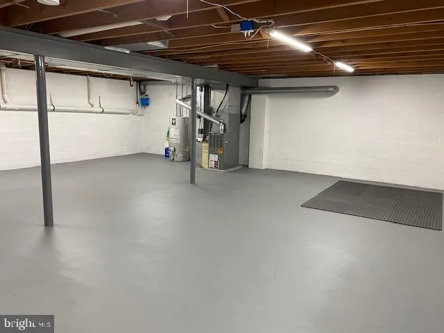 a view of storage and utility room with washer and dryer