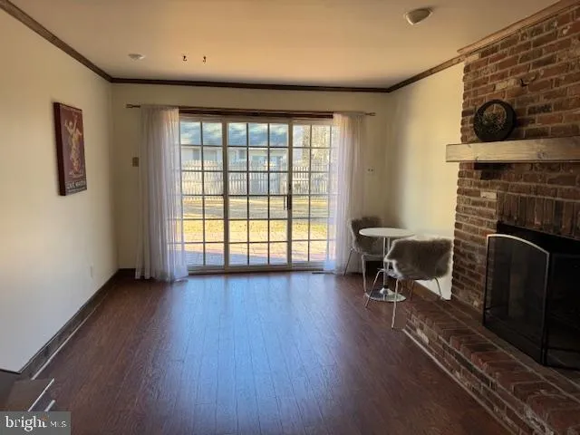 a view of a livingroom with furniture and a fireplace