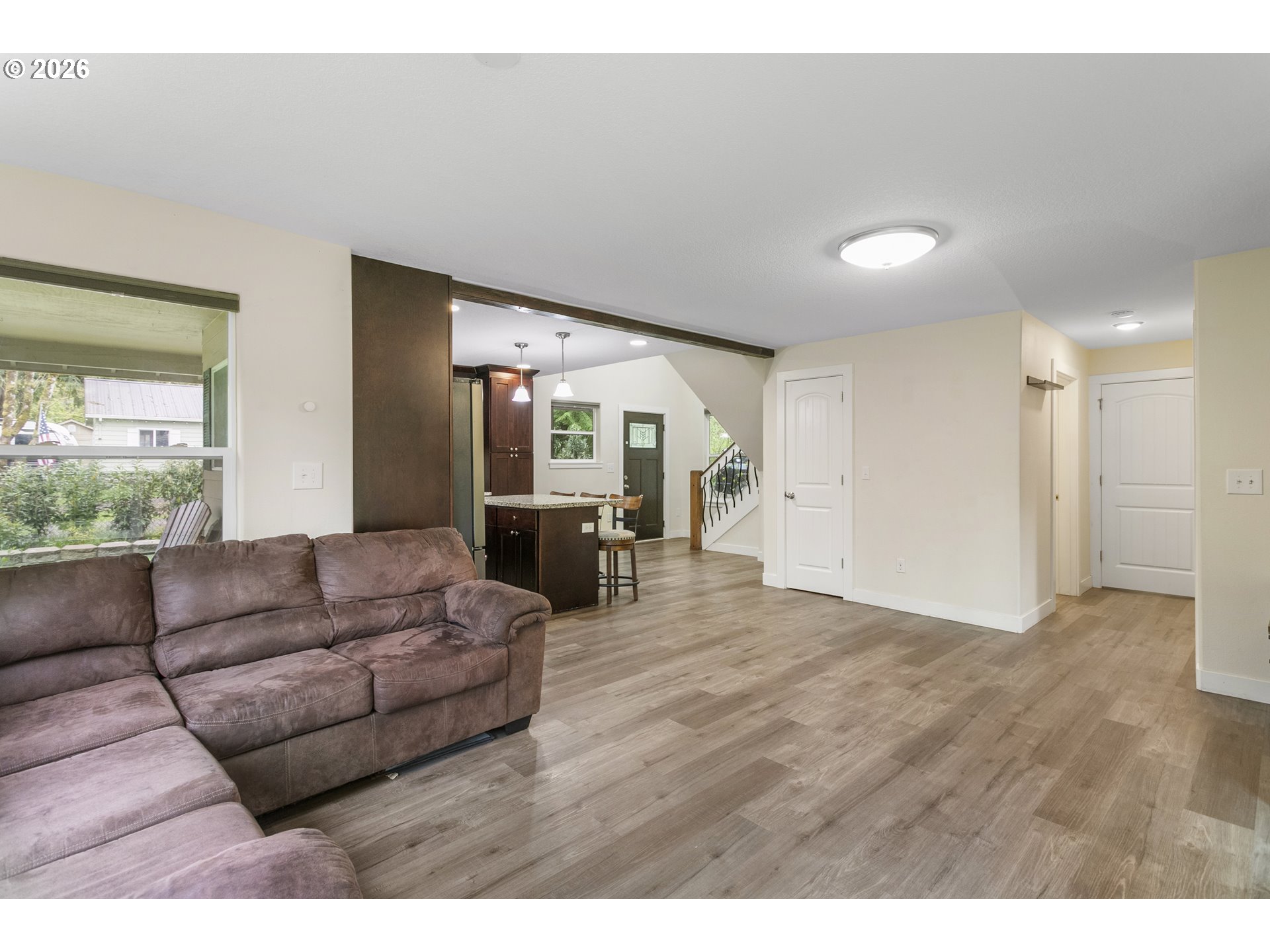 23575 East Gumjuwac Road Welches, OR 97067 - Photo 11 of 48 a living room with furniture and a large window