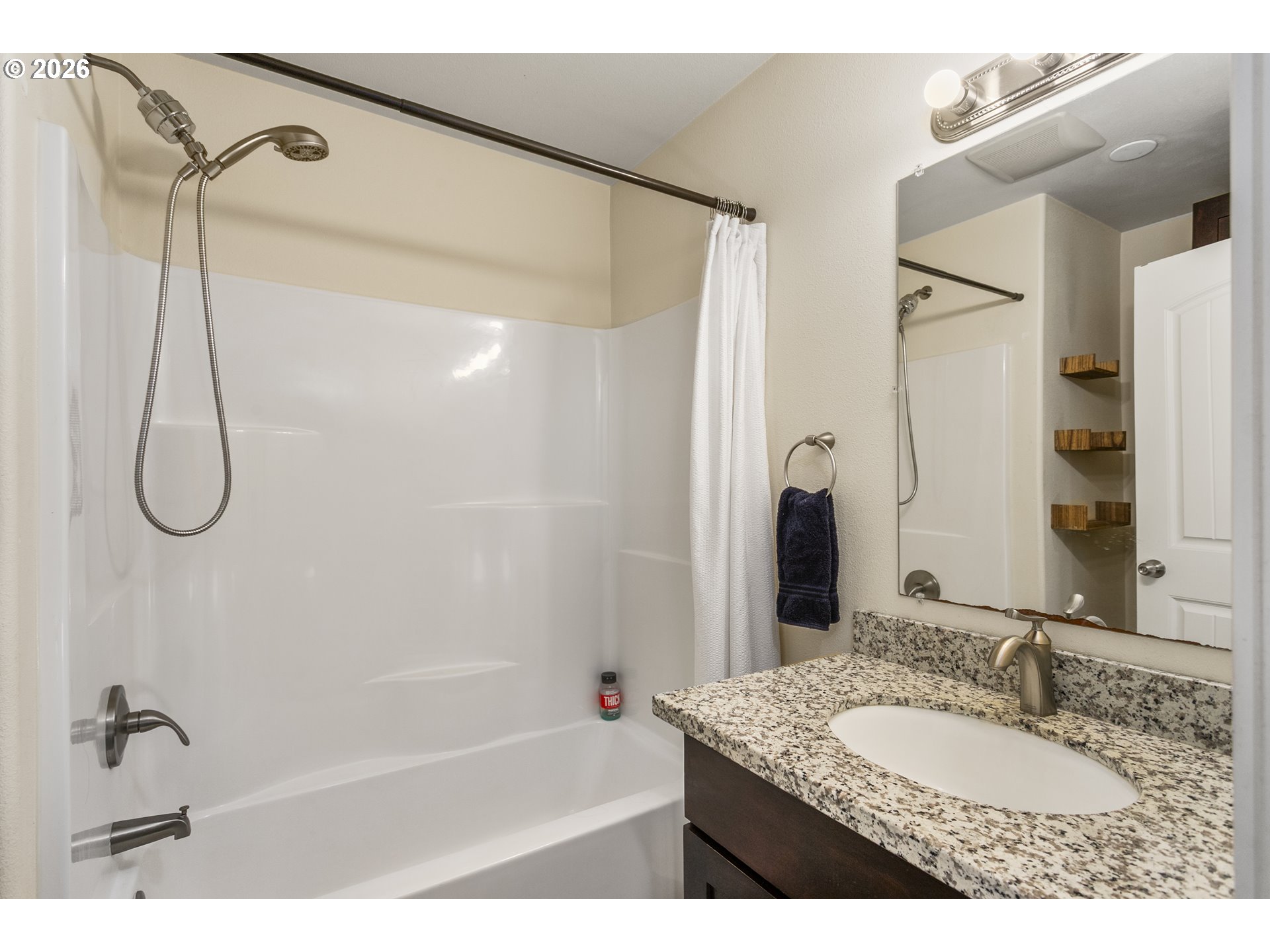 23575 East Gumjuwac Road Welches, OR 97067 - Photo 13 of 48 a bathroom with a granite countertop sink mirror and a shower
