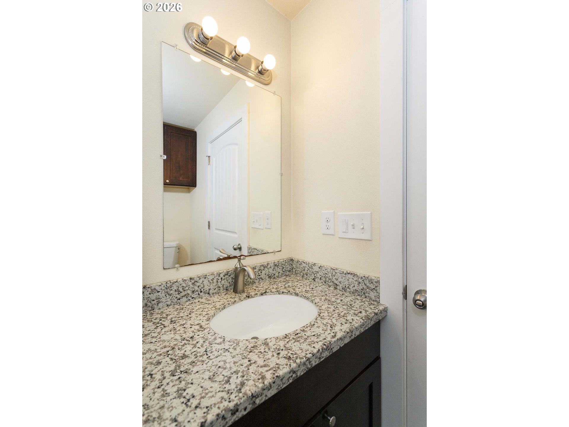 23575 East Gumjuwac Road Welches, OR 97067 - Photo 14 of 48 a bathroom with a granite countertop sink and a mirror