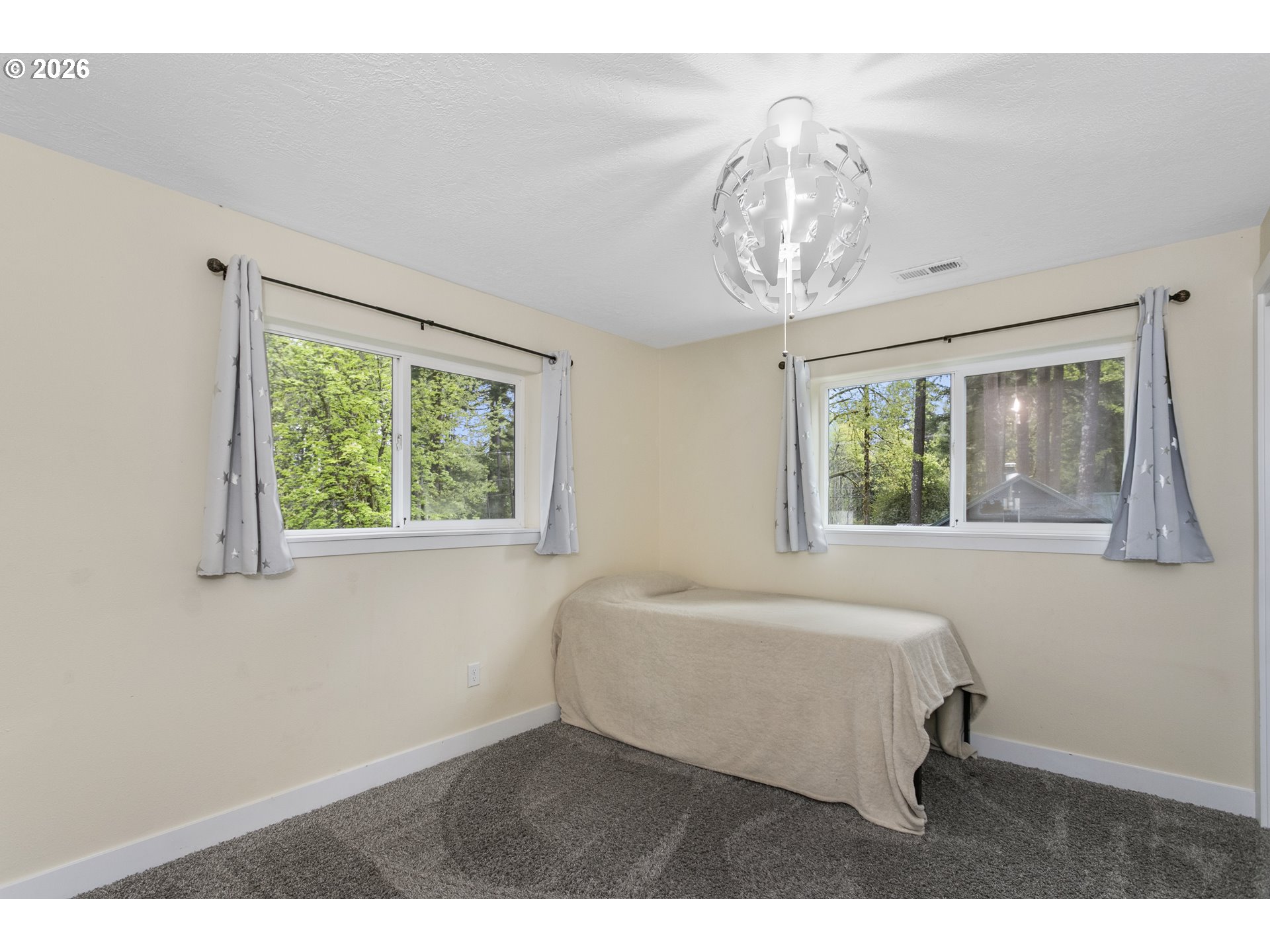 23575 East Gumjuwac Road Welches, OR 97067 - Photo 24 of 48 a bedroom with a bed and a window