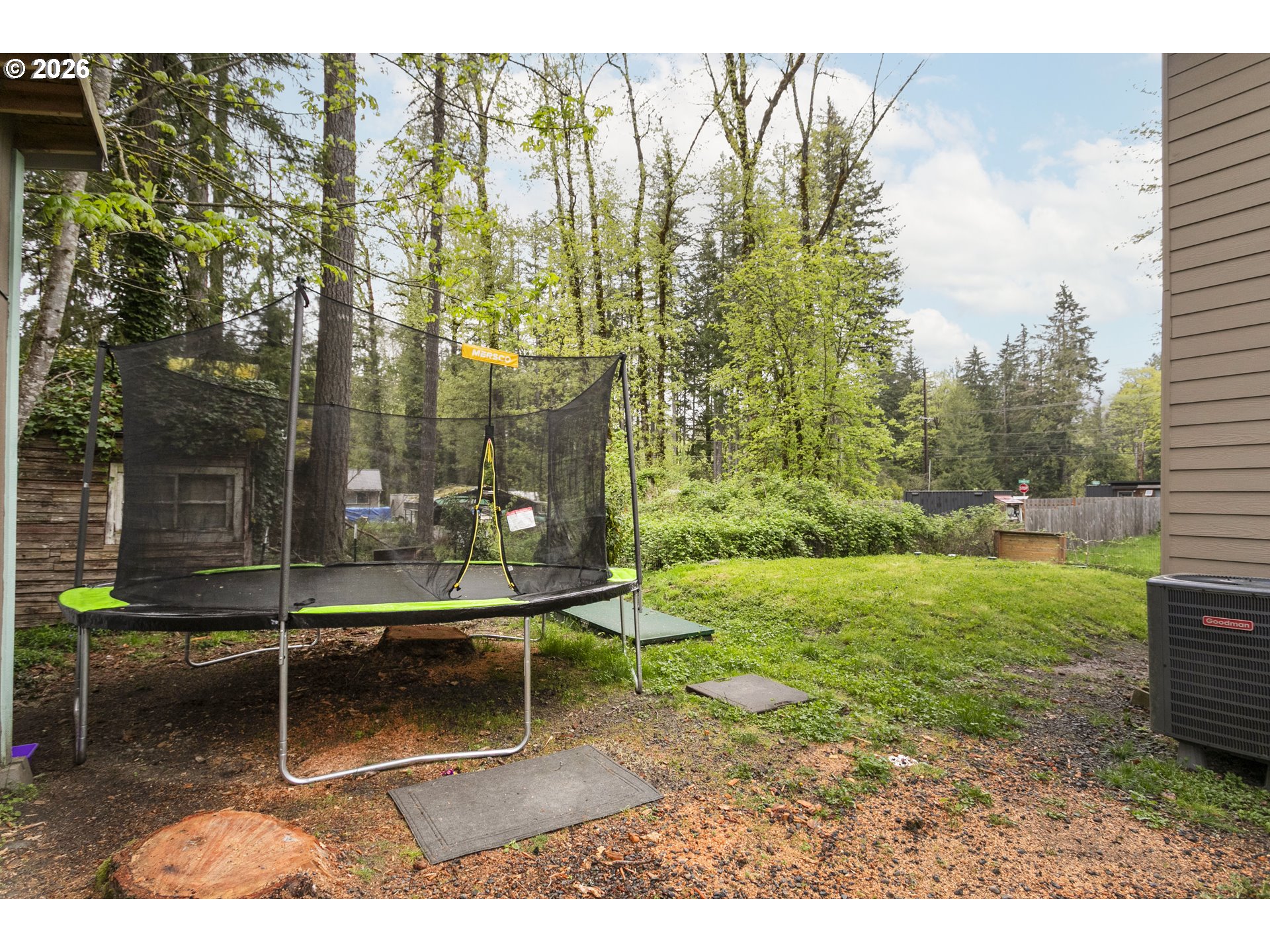 23575 East Gumjuwac Road Welches, OR 97067 - Photo 34 of 48 a backyard of a house with table and chairs