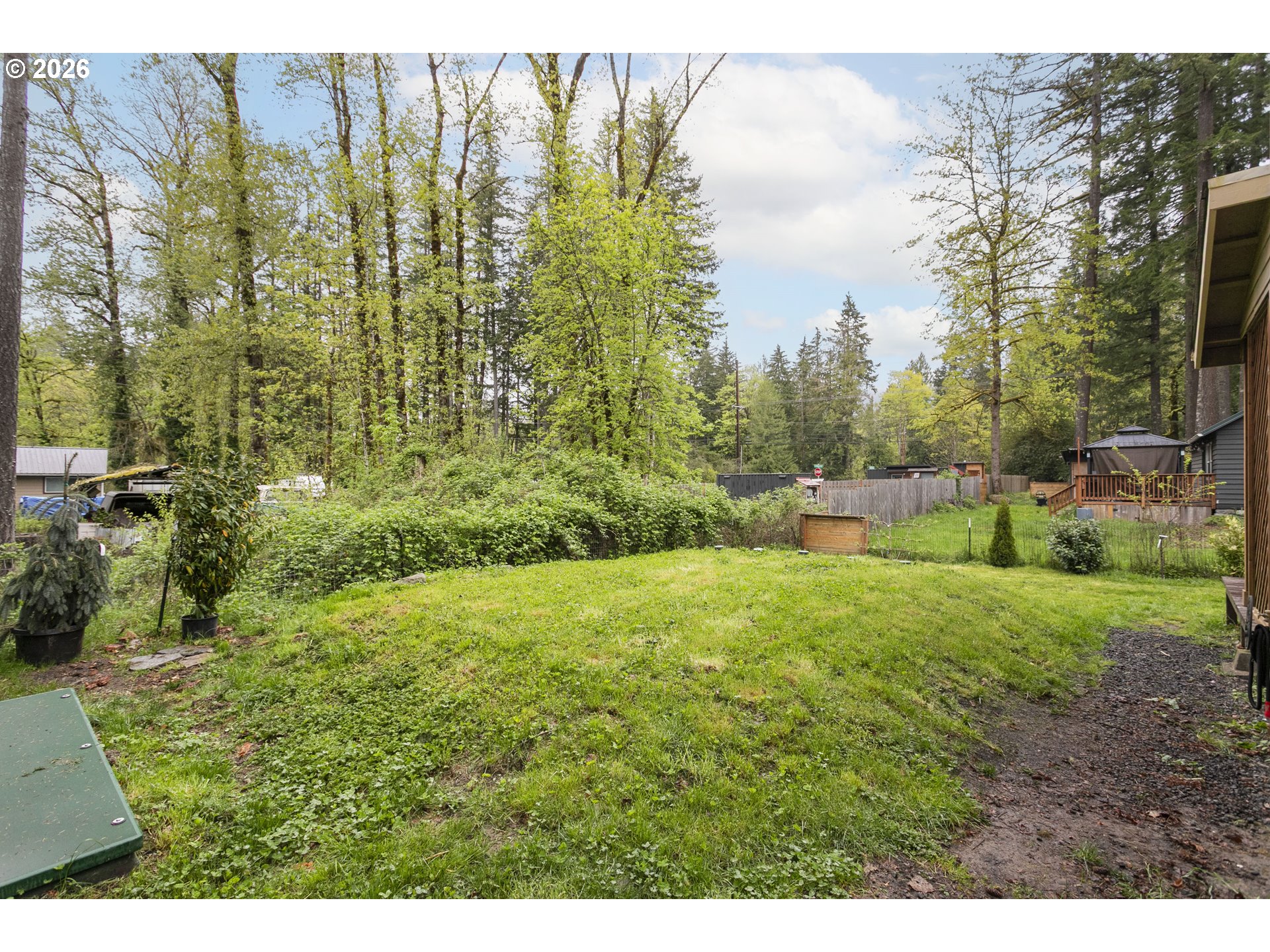 23575 East Gumjuwac Road Welches, OR 97067 - Photo 35 of 48 a view of a yard with an outdoor space