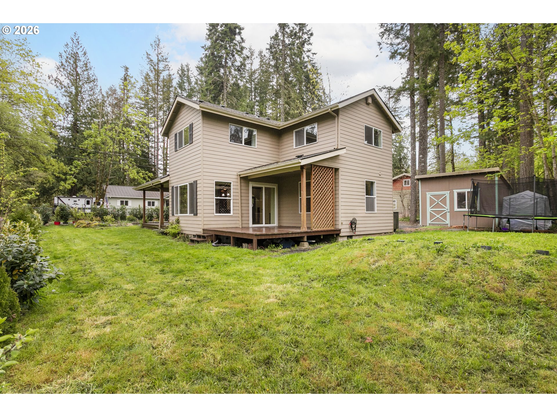 23575 East Gumjuwac Road Welches, OR 97067 - Photo 37 of 48 a view of a house with backyard and garden