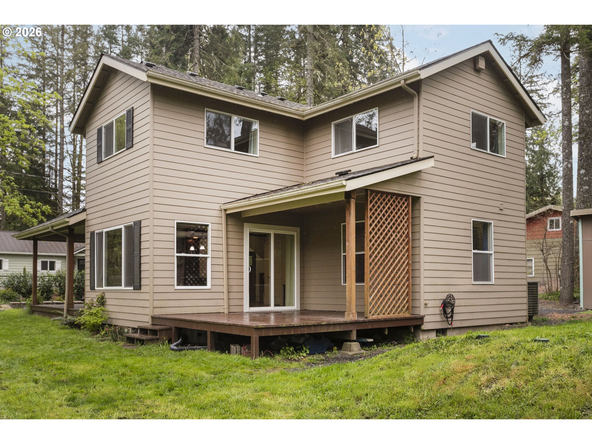 23575 East Gumjuwac Road Welches, OR 97067 - Photo 38 of 48 a view of a house with a yard