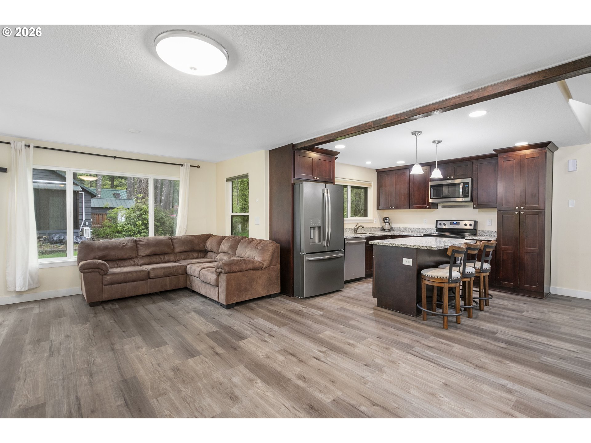23575 East Gumjuwac Road Welches, OR 97067 - Photo 4 of 48 a living room with stainless steel appliances furniture and a kitchen view