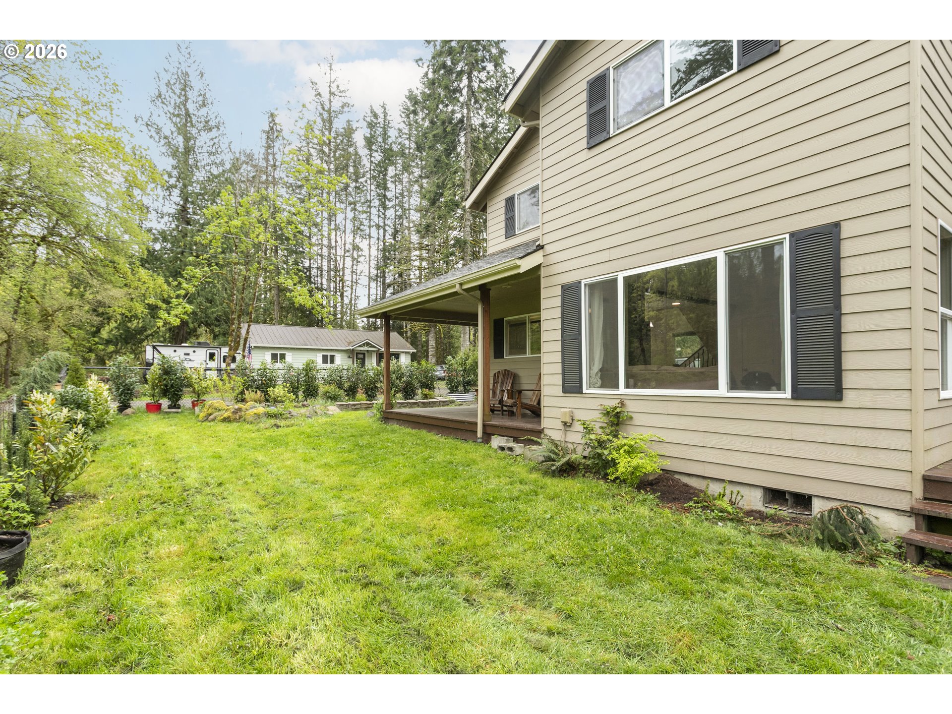 23575 East Gumjuwac Road Welches, OR 97067 - Photo 43 of 48 a view of a house with backyard and garden