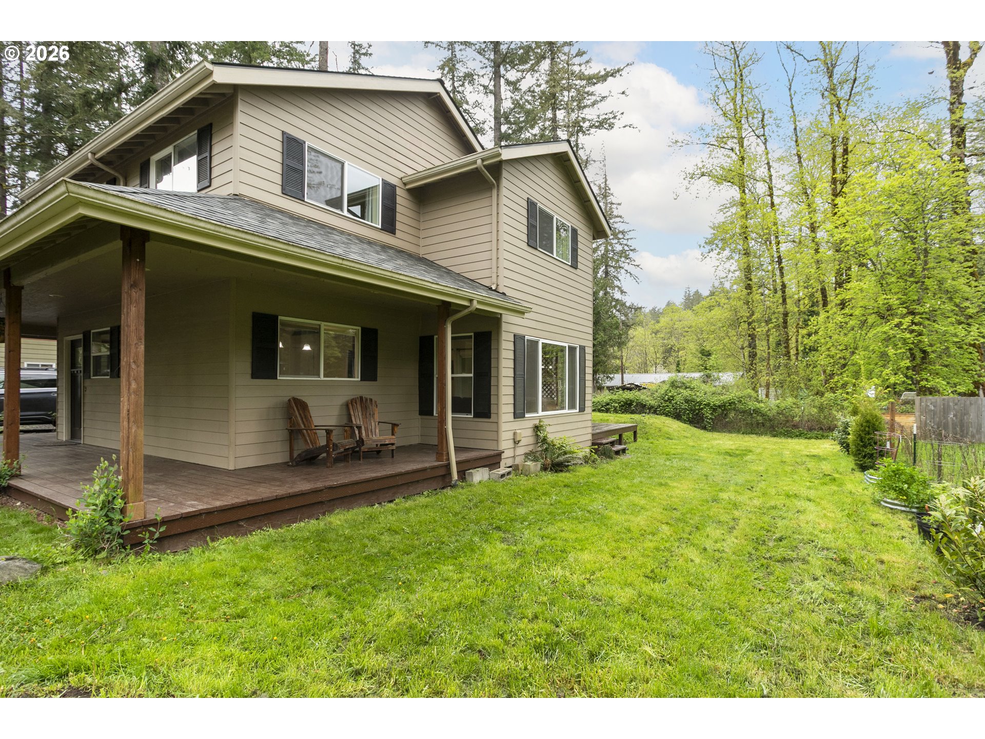 23575 East Gumjuwac Road Welches, OR 97067 - Photo 45 of 48 a view of a house with a yard and sitting area