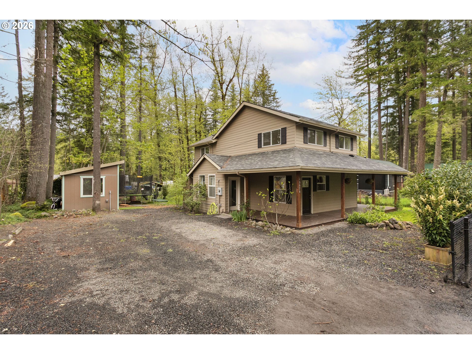 23575 East Gumjuwac Road Welches, OR 97067 - Photo 47 of 48 a front view of a house with garden