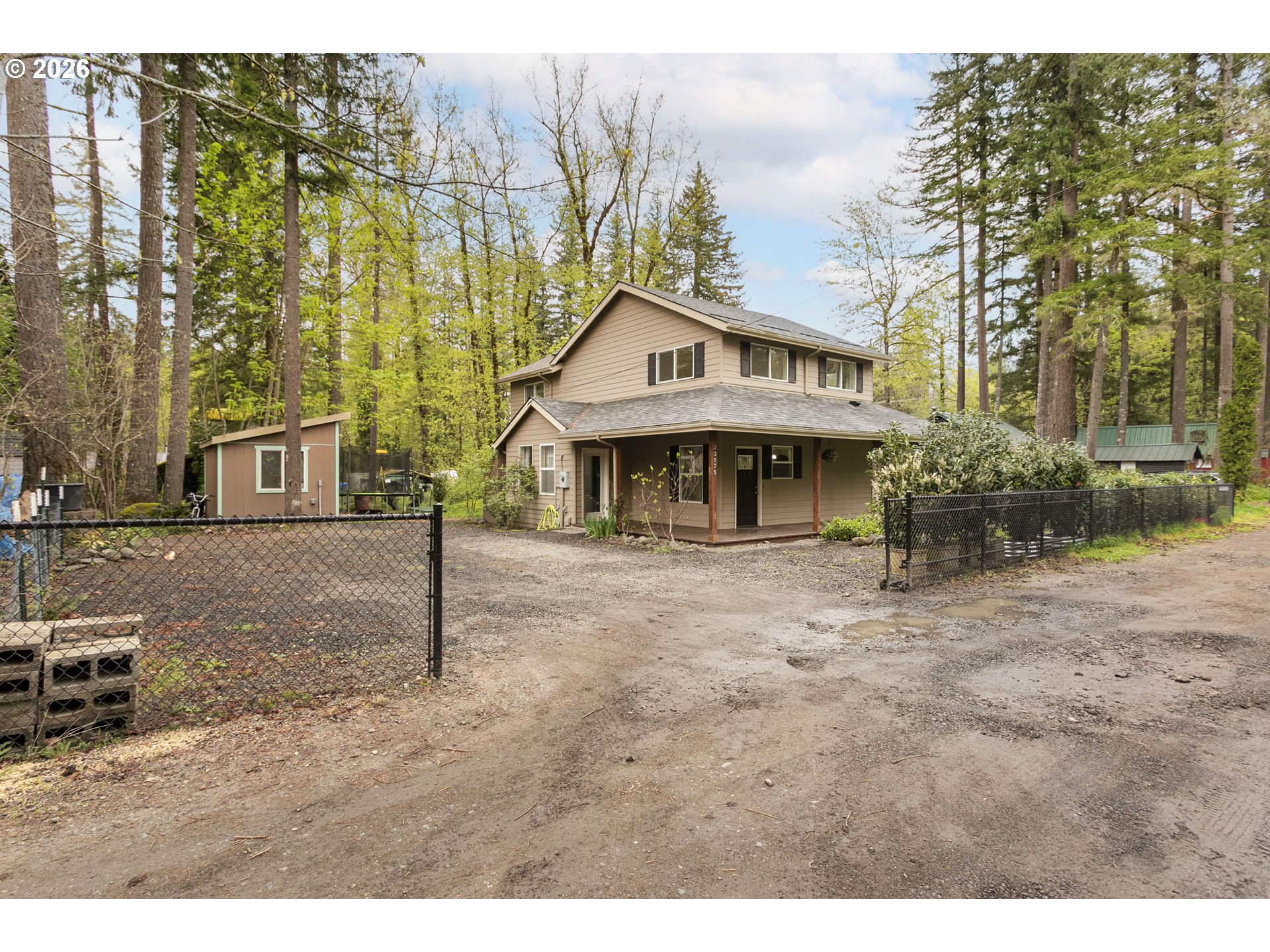 23575 East Gumjuwac Road Welches, OR 97067 - Photo 48 of 48 a view of a house with a yard and large tree