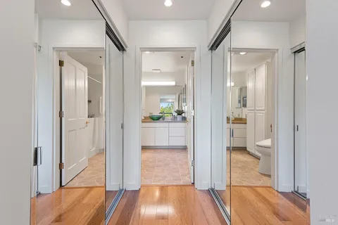 a bathroom with a glass shower door a toilet and a sink