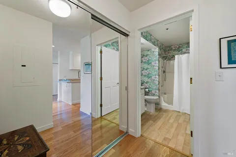 a view of entryway with livingroom and wooden floor