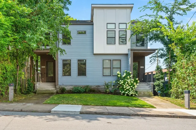 front view of a house with a yard