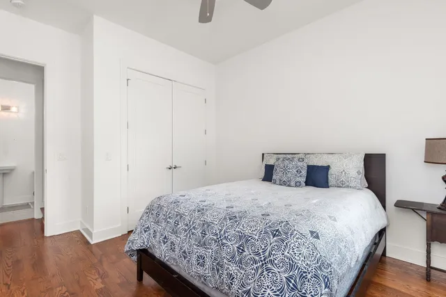 a bedroom with a bed and a dresser