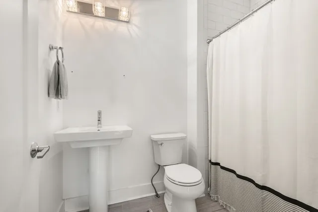 a bathroom with a toilet and a sink
