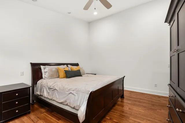 a bedroom with a bed and a dresser