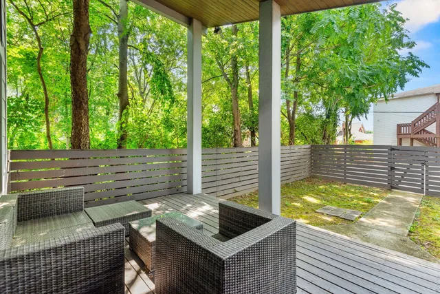 a backyard of a house with barbeque oven