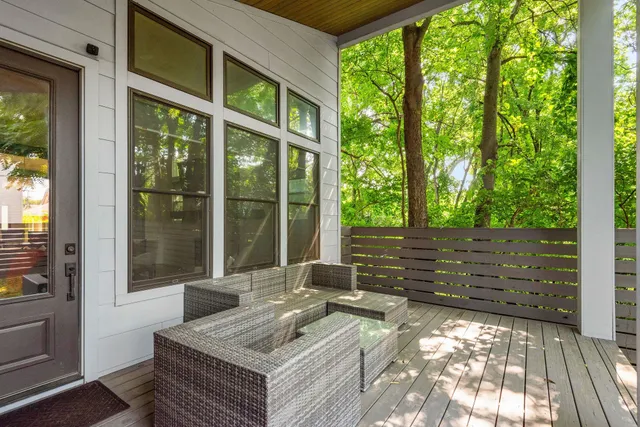 a view of a two chairs in the balcony