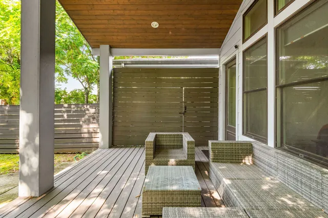 a front view of a house with a floor to ceiling window