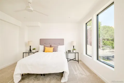 a bedroom with a bed and window