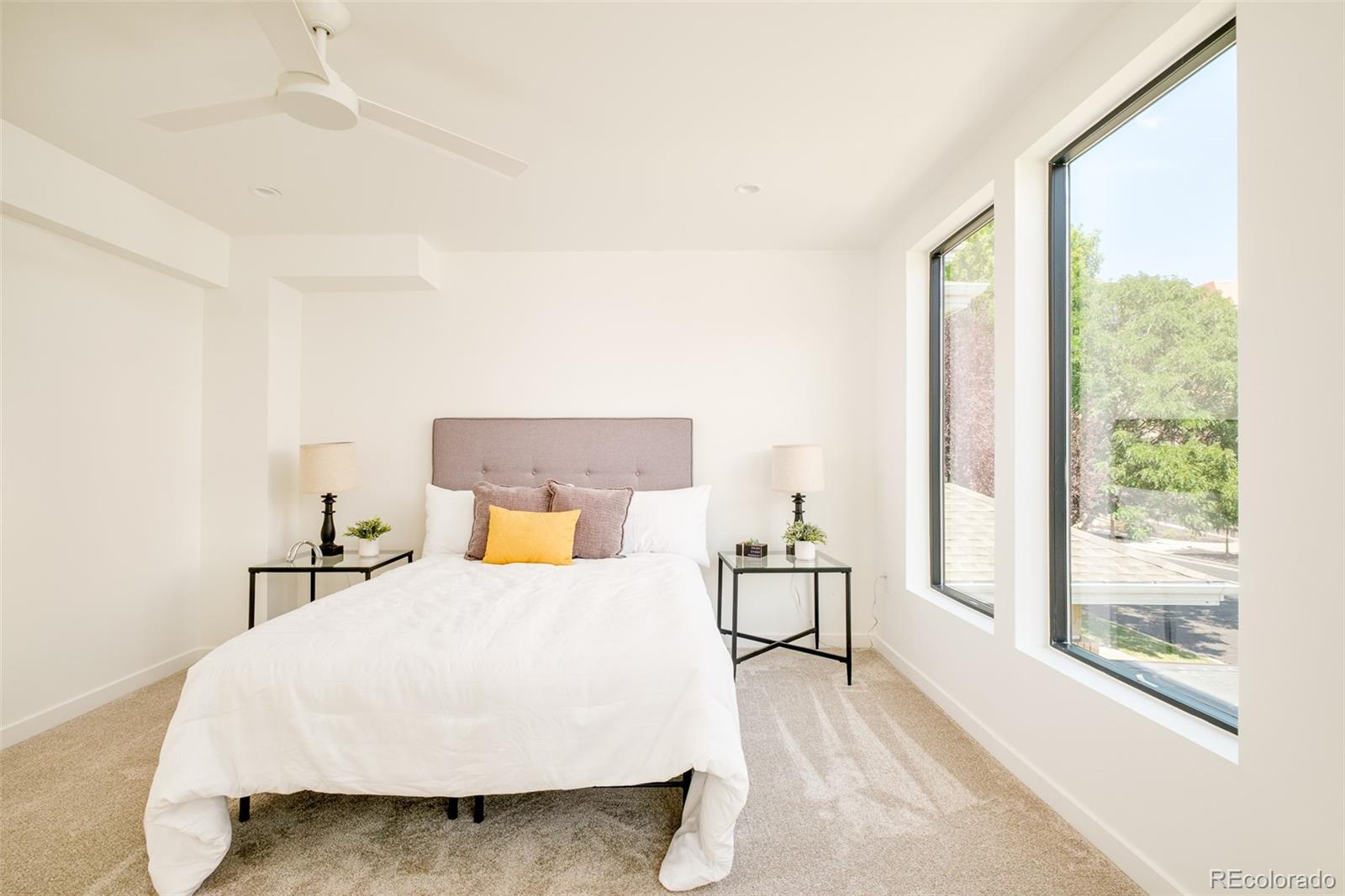 263 South Jackson Street Denver, CO 80209 - Photo 11 of 35 a bedroom with a bed and window