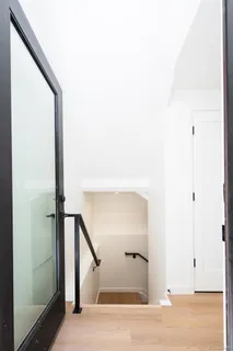 a view of a room with wooden floor