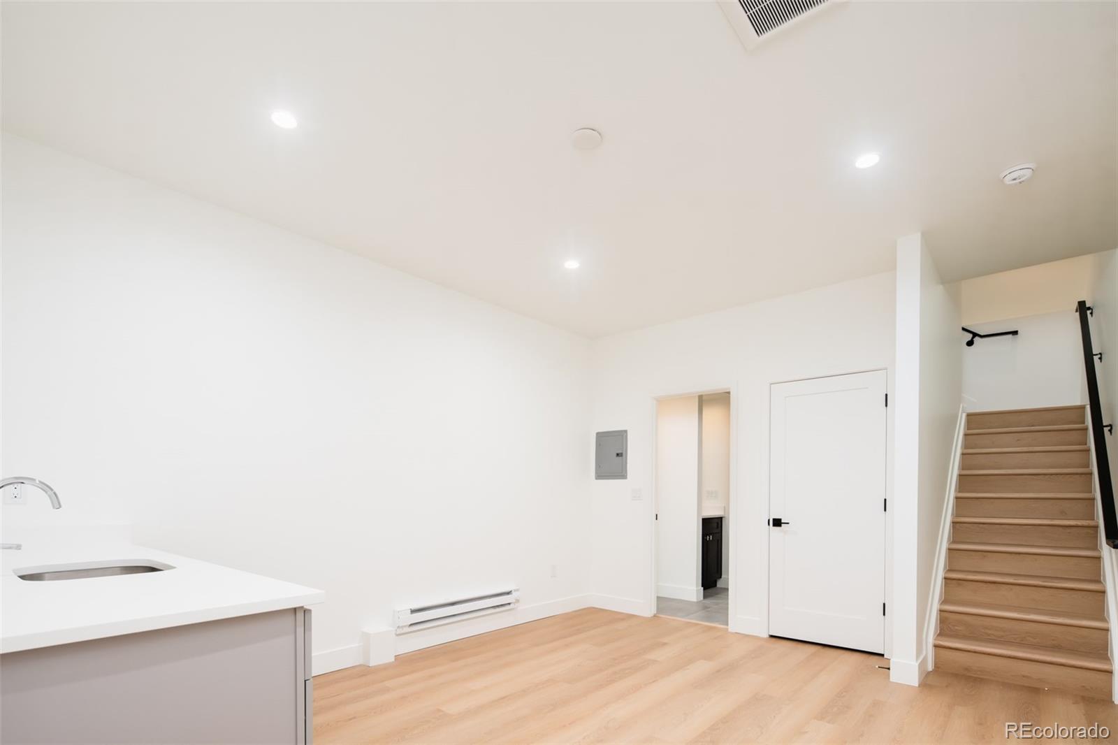 263 South Jackson Street Denver, CO 80209 - Photo 28 of 35 a bathroom with a sink and a mirror