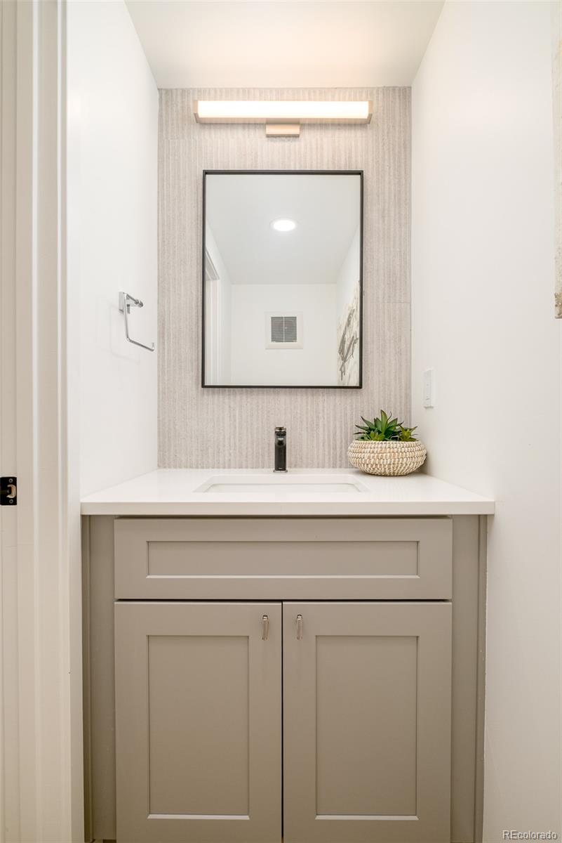 263 South Jackson Street Denver, CO 80209 - Photo 9 of 35 a sink with a mirror