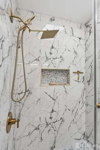 a view of a backyard with a garden and tree