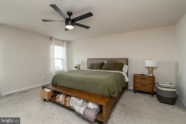 a bedroom with a bed and flat screen tv