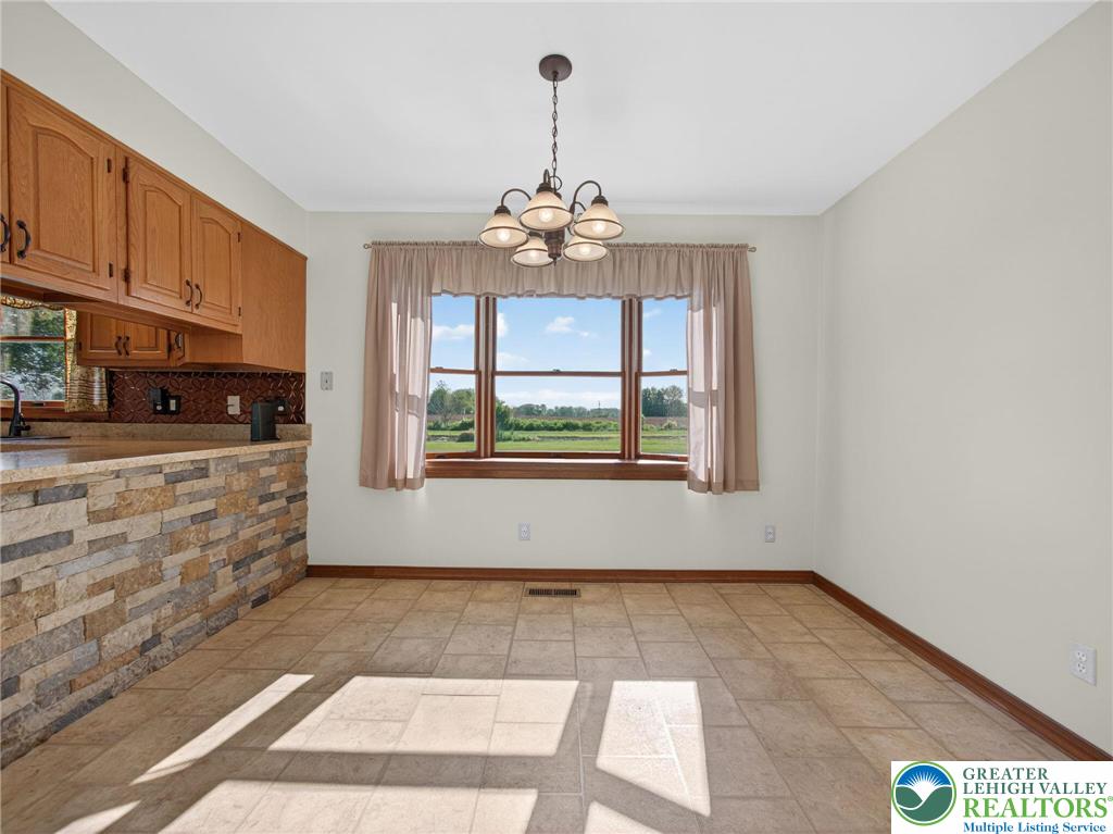 7098 Limerick Square Bath, PA 18014 - Photo 9 of 31 a view of kitchen with granite countertop natural light