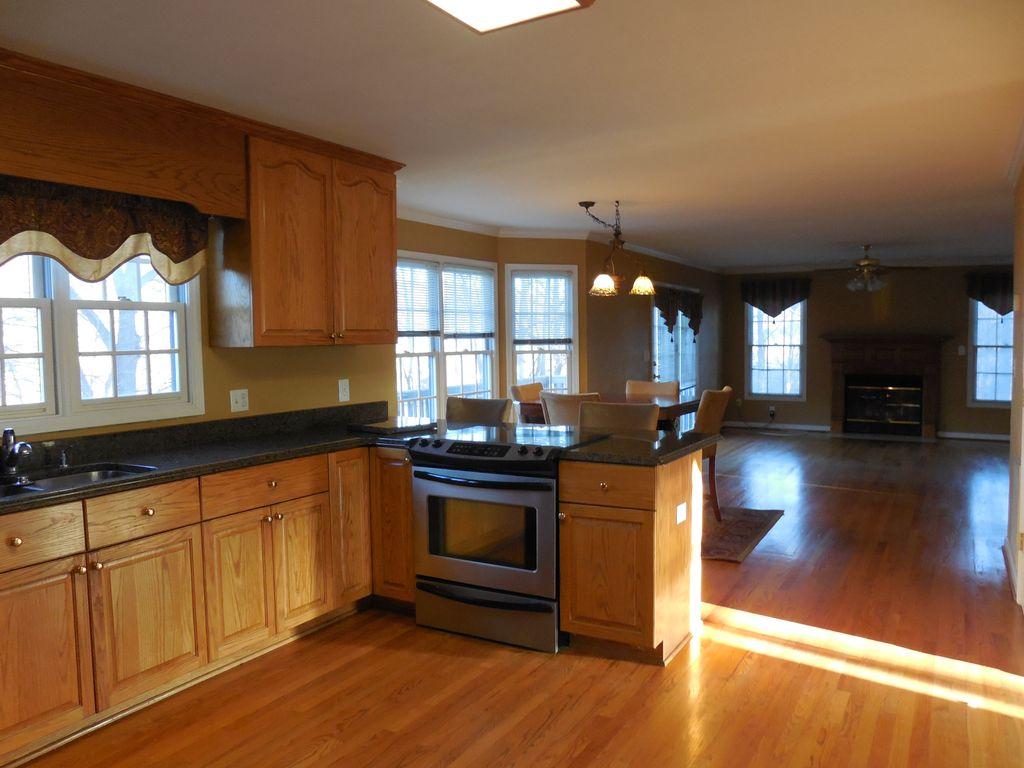 222 MacGregor Drive Blue Ridge, VA 24064 - Photo 8 of 25 a kitchen with stainless steel appliances granite countertop a stove a sink and a wooden floors