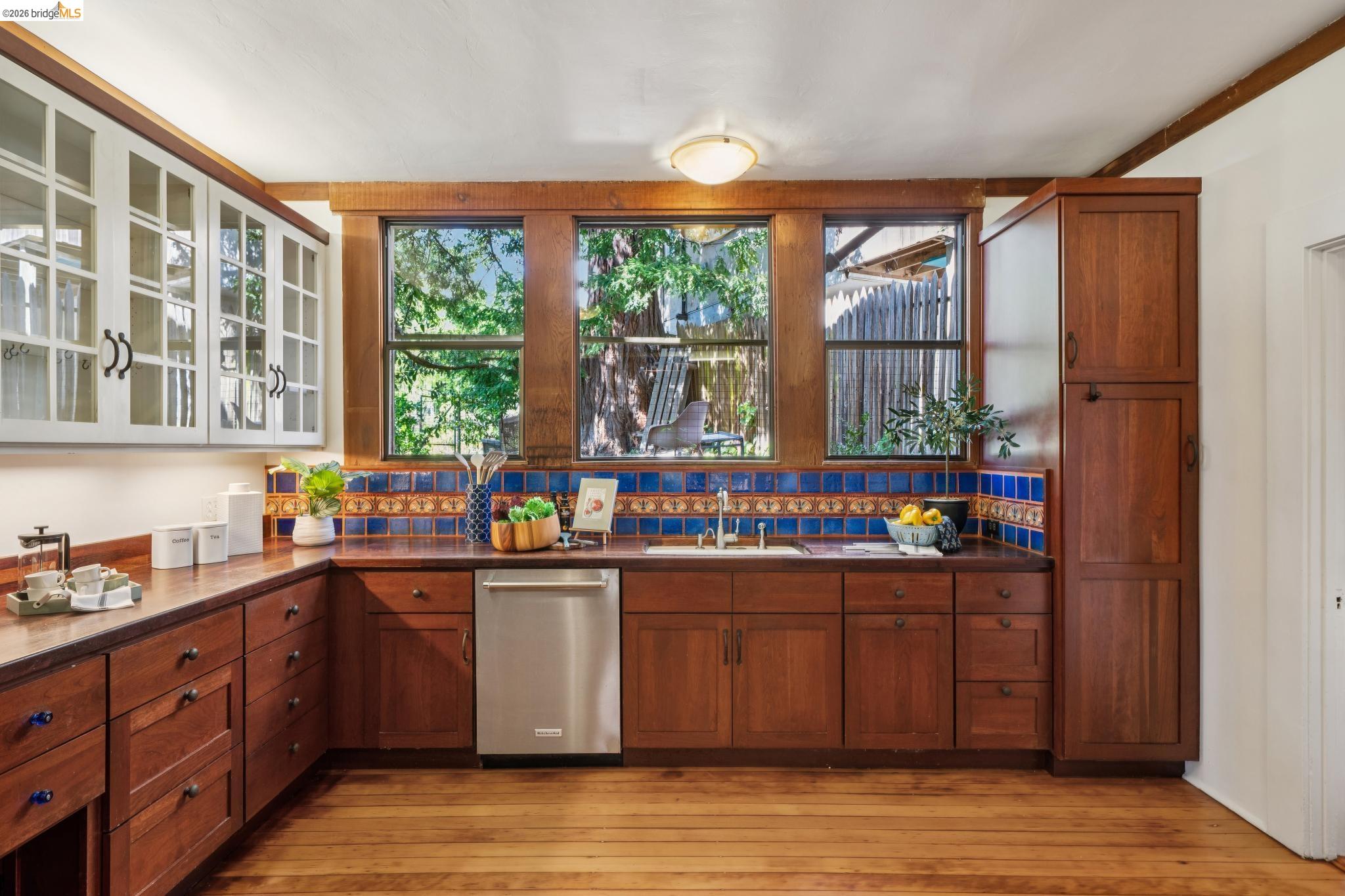 813 San Diego Road Berkeley, CA 94707 - Photo 21 of 60 a kitchen with stainless steel appliances granite countertop a stove and cabinets