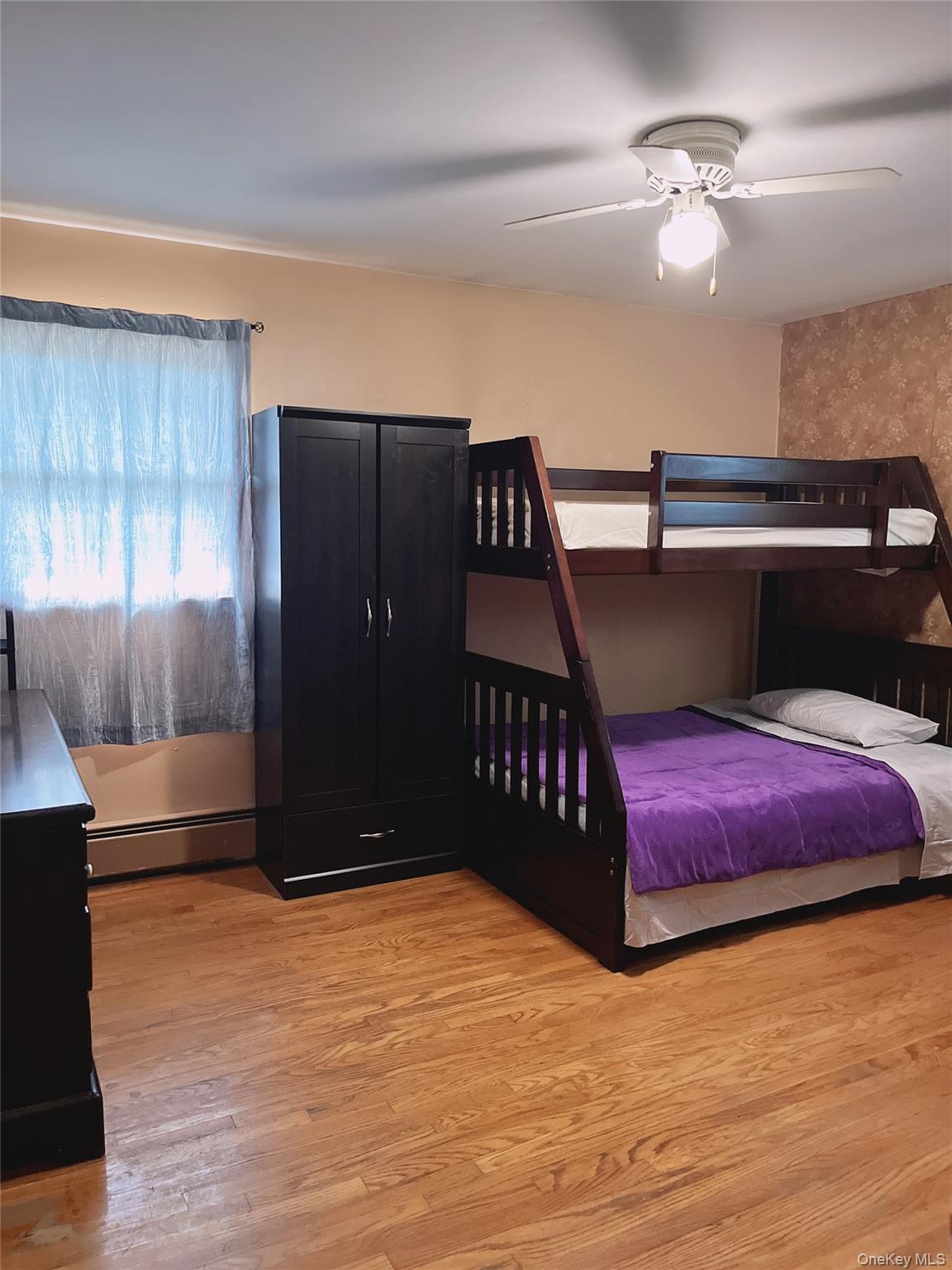 225 Monhagen Avenue Middletown, NY 10940 - Photo 11 of 19 a bedroom with a bed and a dresser