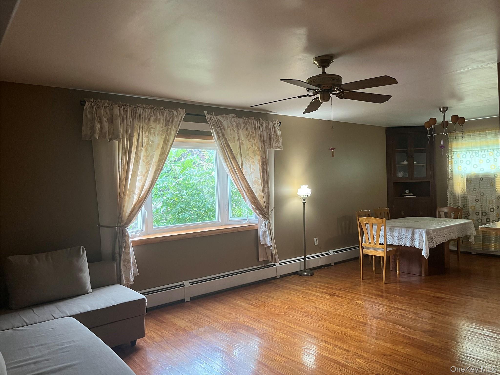 225 Monhagen Avenue Middletown, NY 10940 - Photo 18 of 19 a living room with furniture and a wooden floor