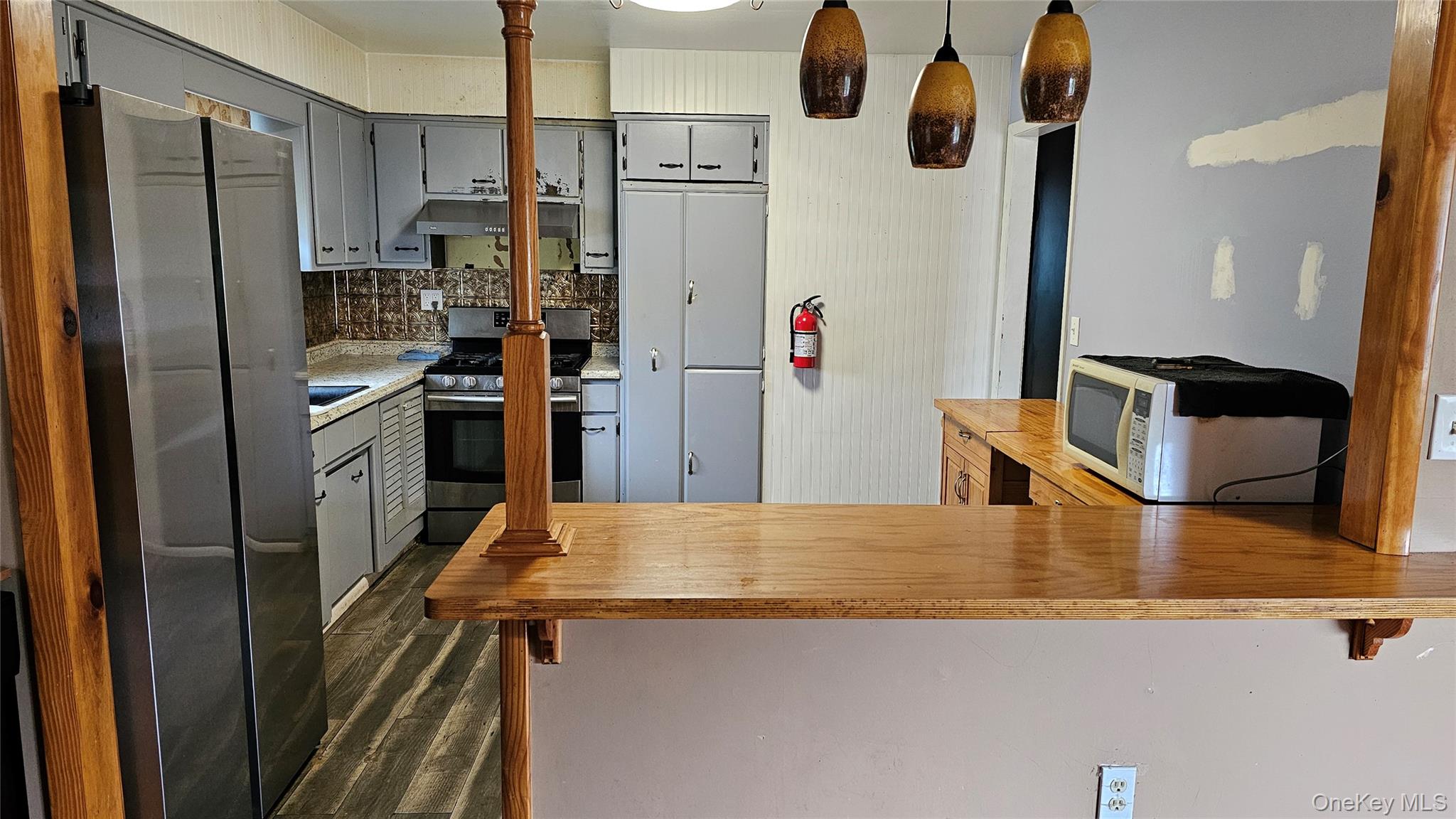 225 Monhagen Avenue Middletown, NY 10940 - Photo 4 of 19 a kitchen with stainless steel appliances granite countertop a refrigerator and a stove