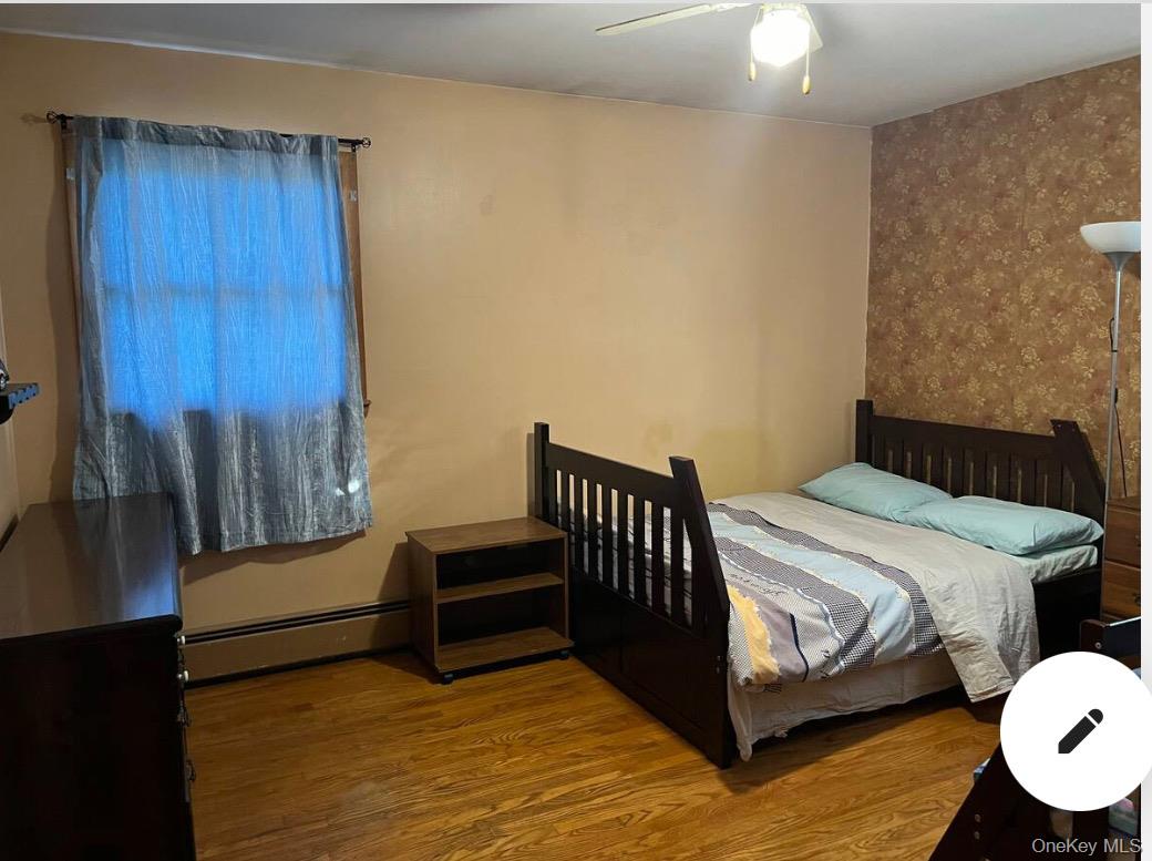 225 Monhagen Avenue Middletown, NY 10940 - Photo 7 of 19 a bedroom with a bed and cabinet