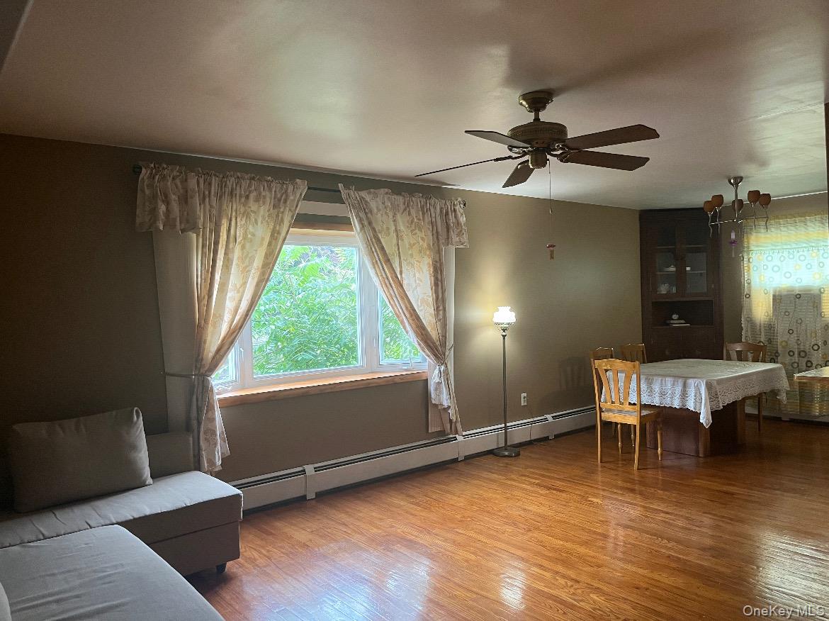 225 Monhagen Avenue Middletown, NY 10940 - Photo 9 of 19 a living room with furniture and a wooden floor