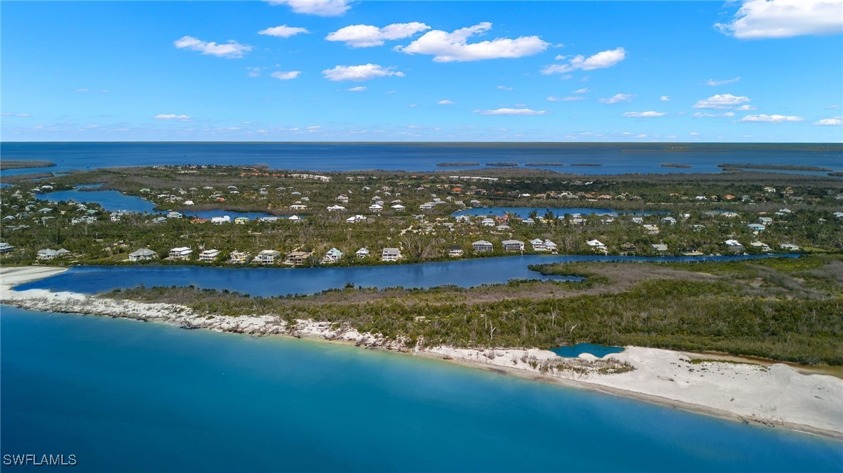 5869 Pine Tree Drive Sanibel, FL 33957 - Photo 29 of 30 a view of a city with an ocean